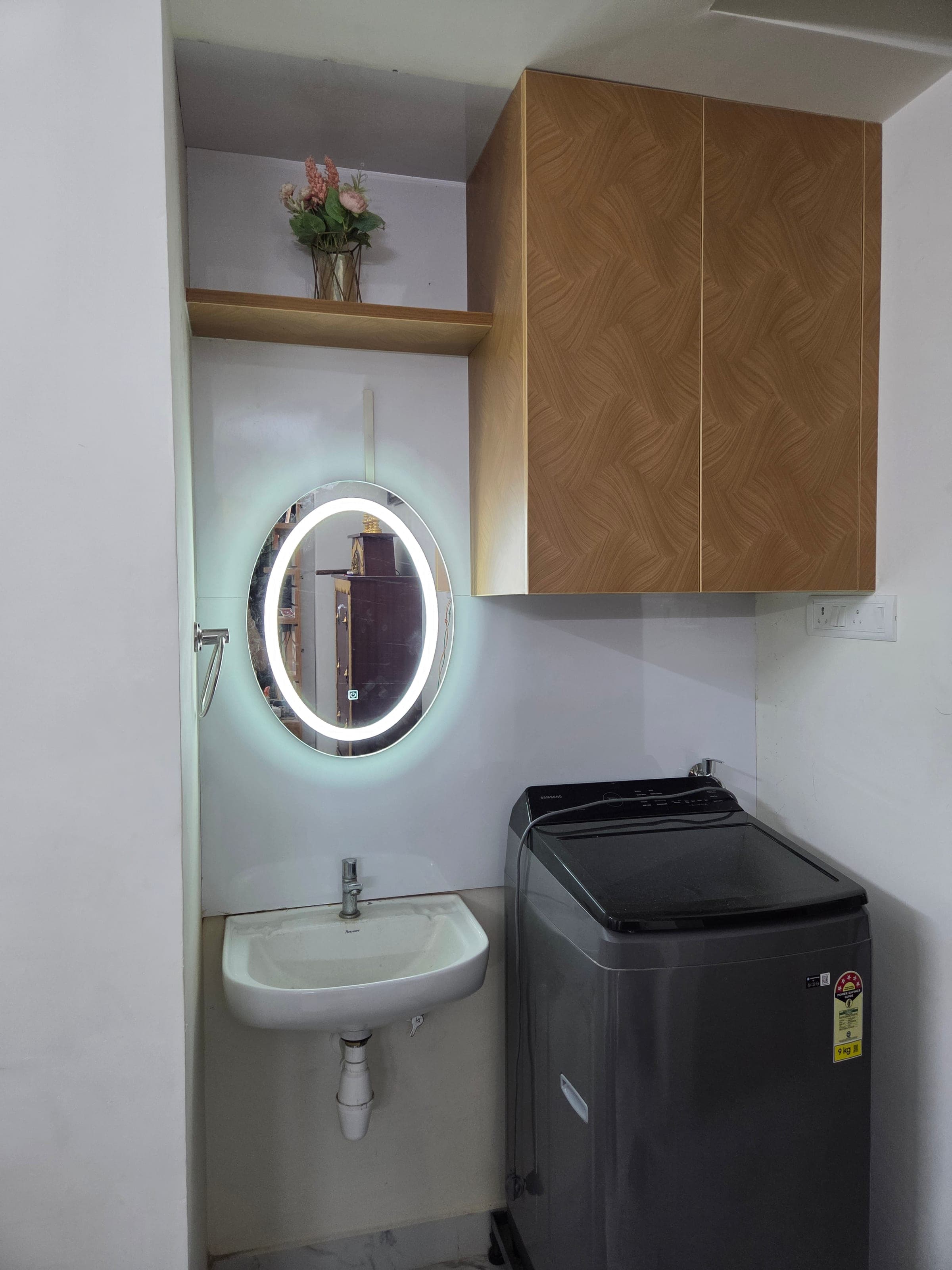 Wall-mounted vanity in warm oak, Vivekananda Nagar